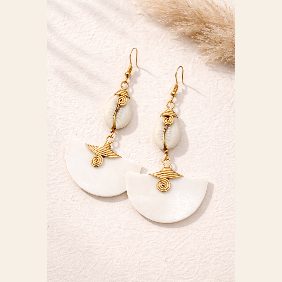 The Muriel’s cow horn drop earrings, handcrafted in Kenya