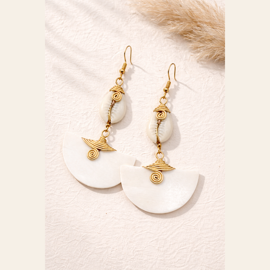The Muriel’s cow horn drop earrings, handcrafted in Kenya