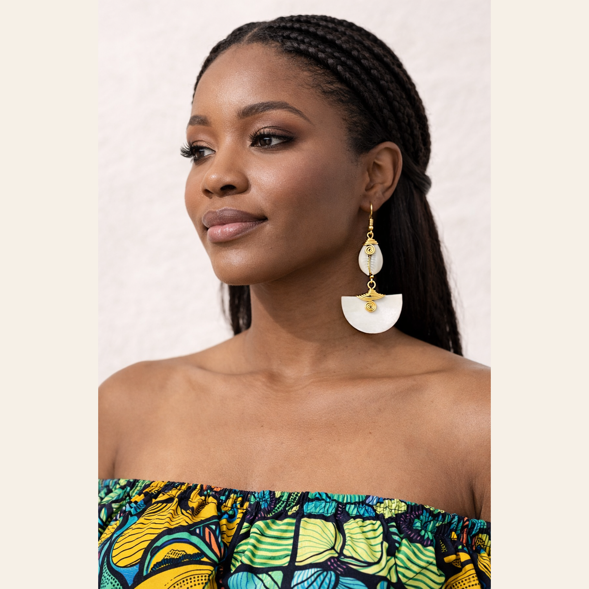 The Muriel’s cow horn drop earrings, handcrafted in Kenya