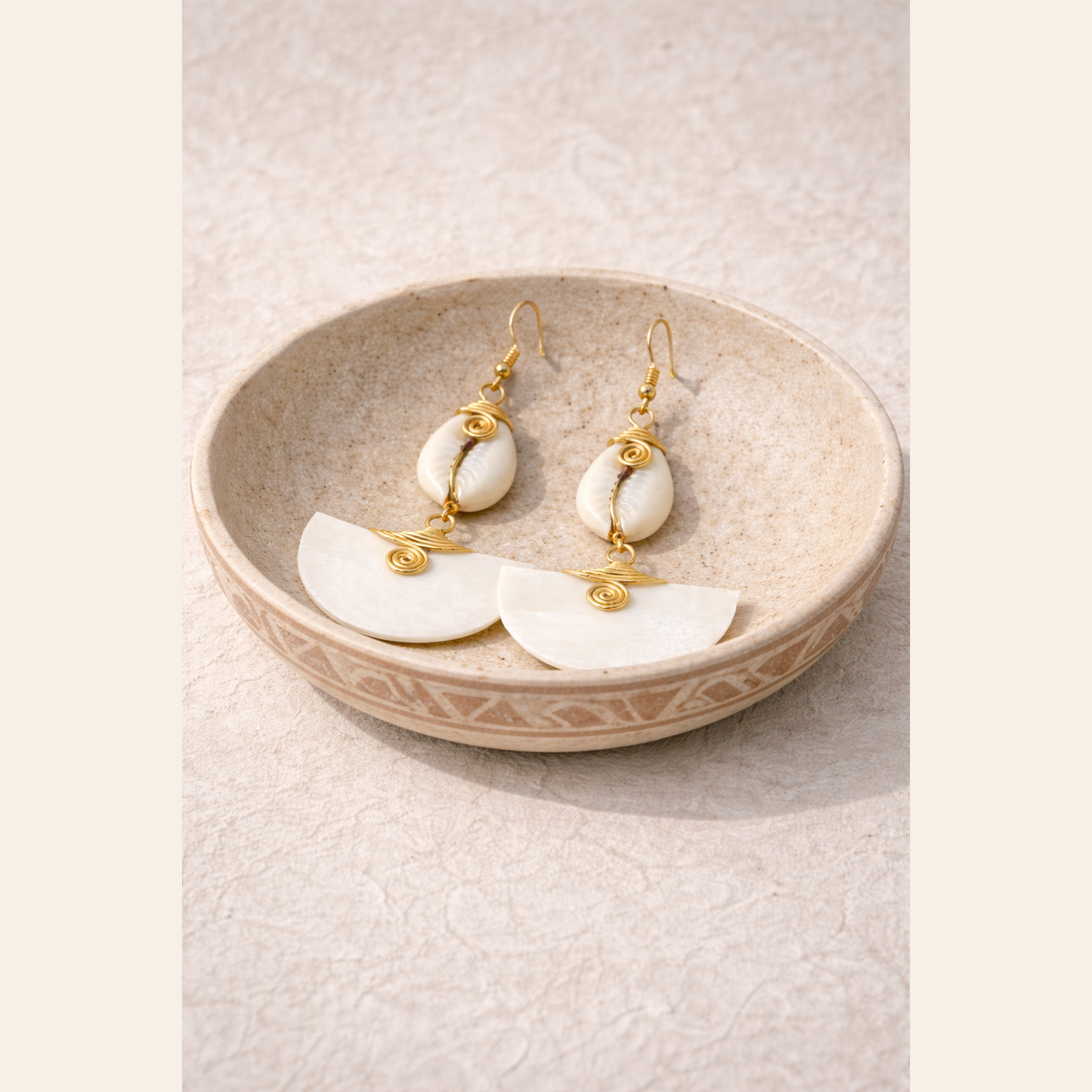 The Muriel’s cow horn drop earrings, handcrafted in Kenya